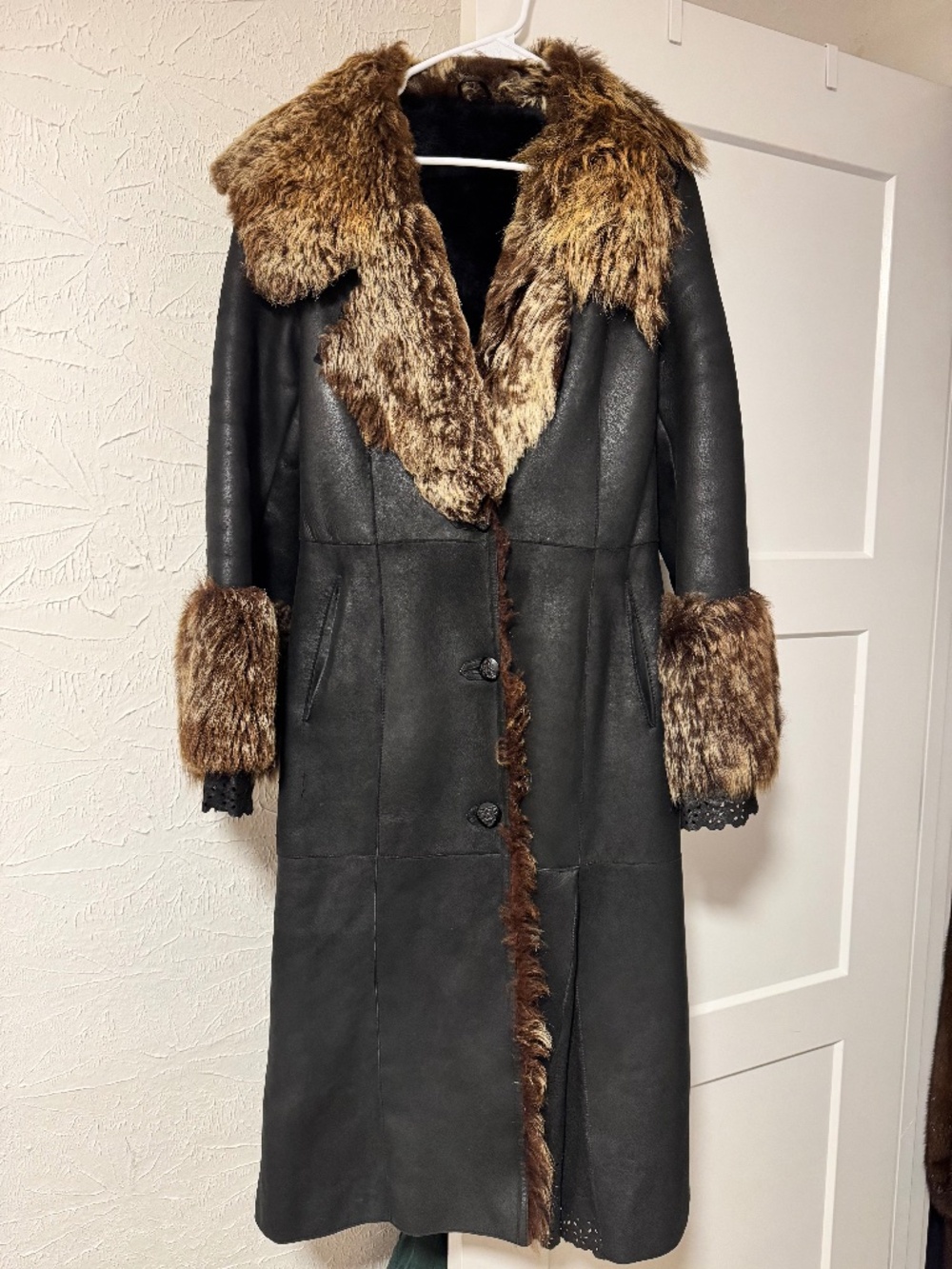 Leather overcoat with sheepskin trim